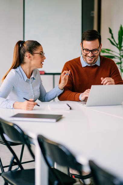 istock Happy businesspeople working at office 1193288954