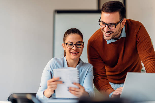 istock Business colleagues working on report 1193289798