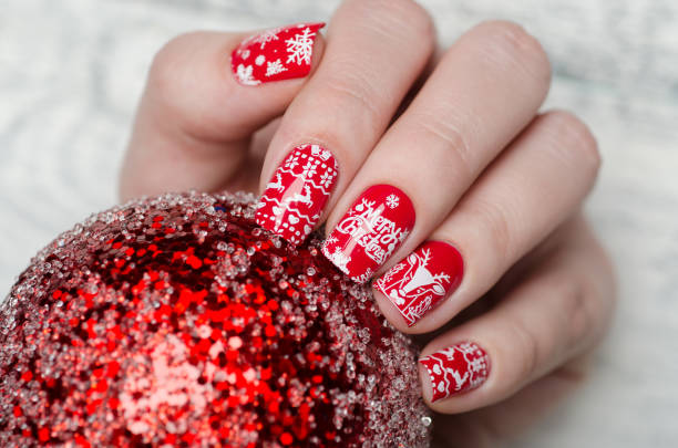 red Christmas manicure with deer and snowflakes