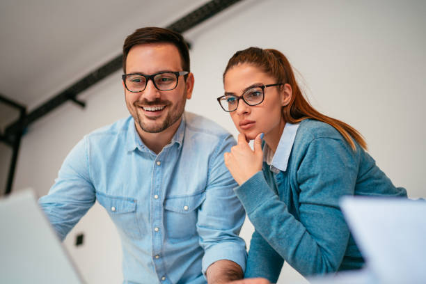 istock Happy business coworkers working together 1193290331