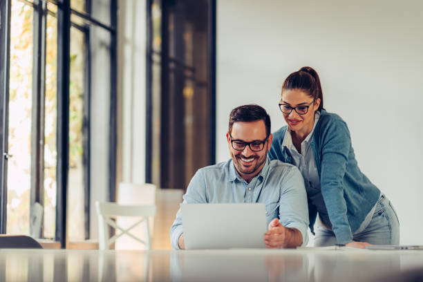 istock Young businesspeople using laptop in the office 1193290417