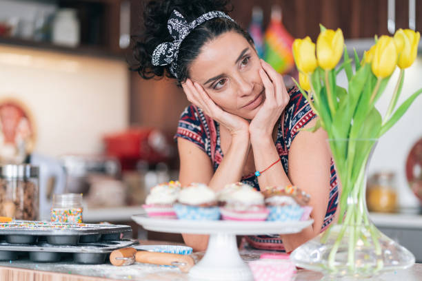 istock Sad mid adult woman having relationship problems, standing in kitchen 1193291436