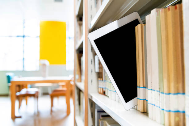 istock Blank digital tablet on the bookshelf 1193291952