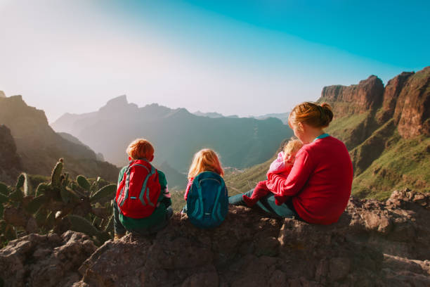 istock mother with three kids hiking in mountains 1193292184