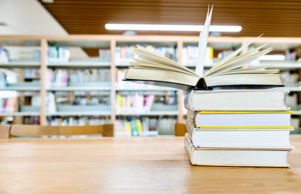 istock Open book on the desk of library 1193293341