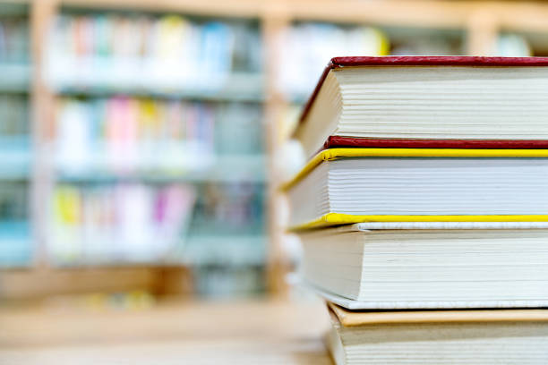 istock Stack of books on the desk of library 1193293731