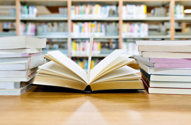 istock Open book on the desk of library 1193294606