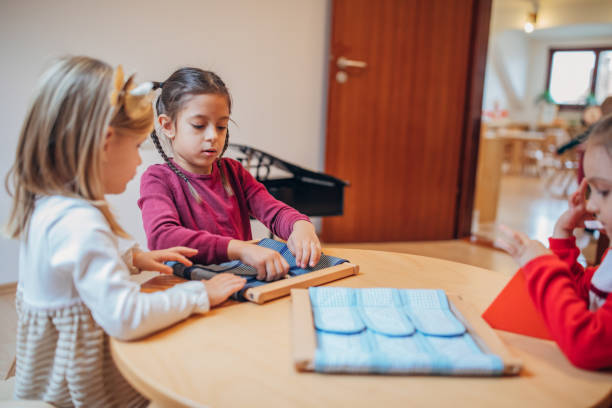 istock Girls playing in preschool classroom 1193295121