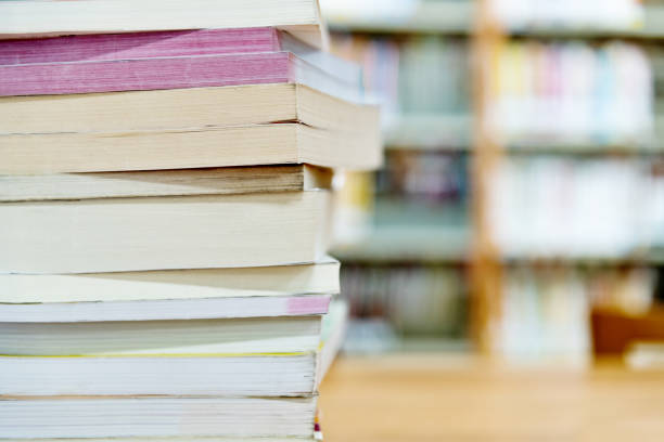 istock Stack of books on the desk of library 1193295290