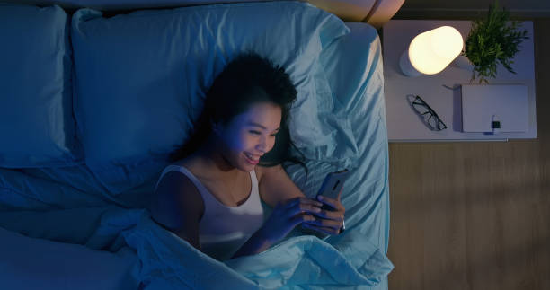 istock woman use smartphone on bed 1193297292