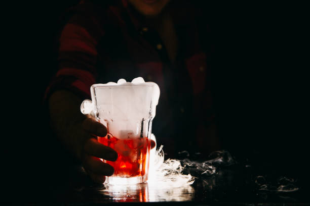 istock Barman serving smoking orange cocktail 1193299027