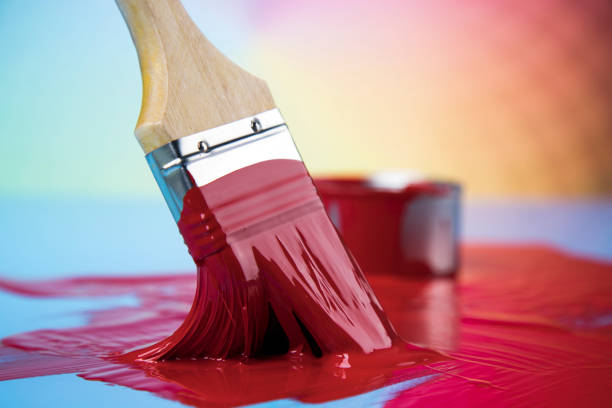 istock Paintbrush on cans with color 1193300554