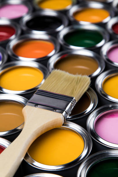 istock Tin metal cans with color paint and paintbrush 1193300859