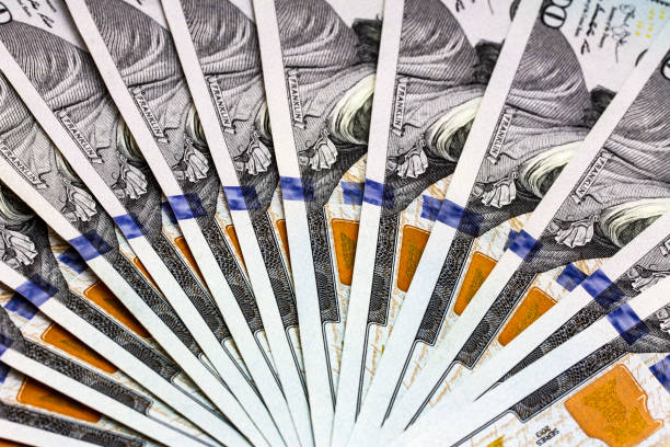 istock Fan of Dollar Banknotes macro close up 1193304842
