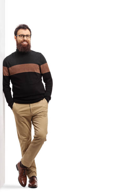 istock Bearded man in a turtleneck cardigan leaning on a wall 1193306134