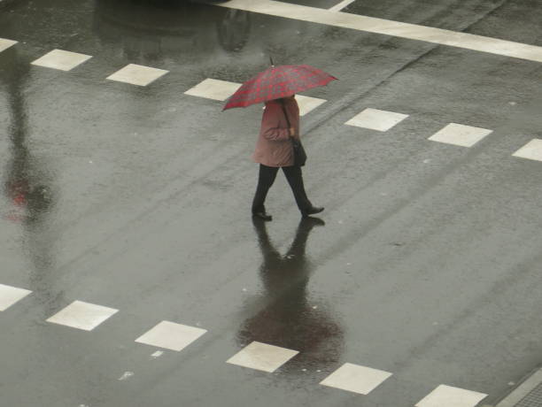 istock People walking in the rain 1193306481