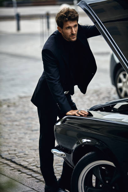 istock man in black suit opened mask 1193306668