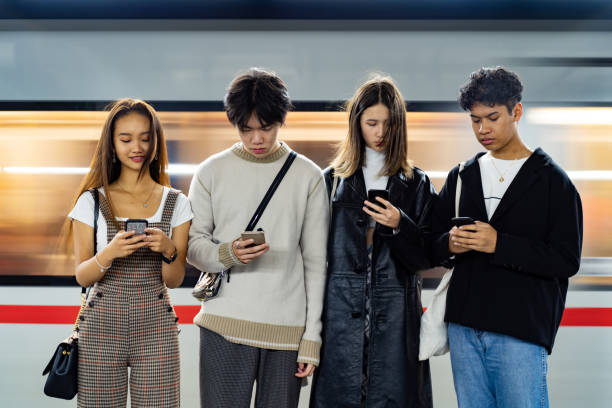 istock Asian friends occupied with smart phone 1193306765