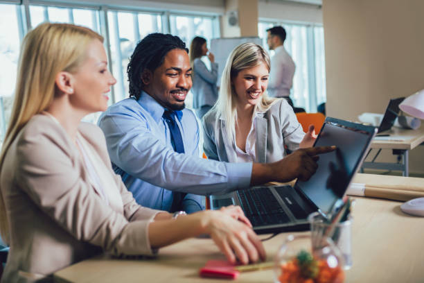istock People looking at colleague showing project plan on his laptop. 1193307342