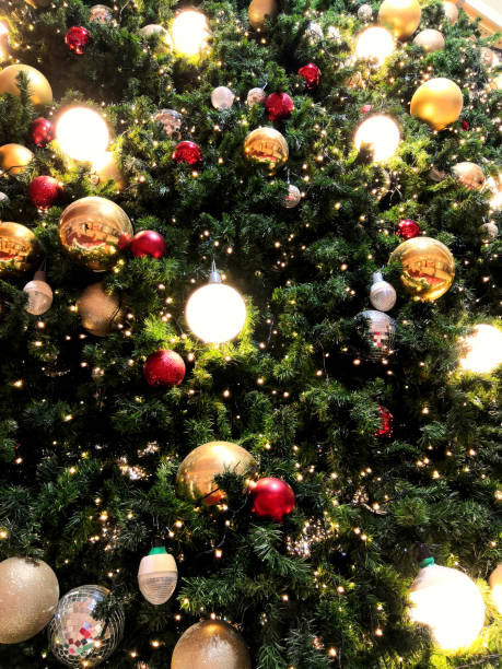 istock Christmas tree decorated with bulbs and red, golden balls 1193307414