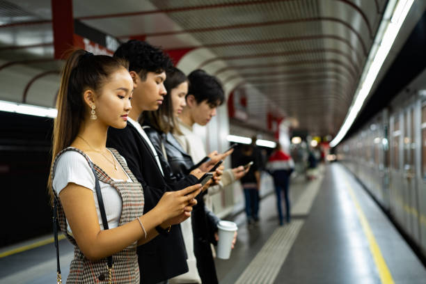 istock Asian friends occupied with smart phone 1193307571