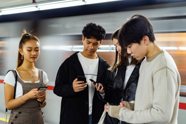 istock Asian friends occupied with smart phone 1193307627