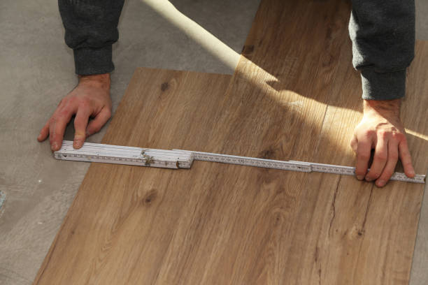 istock The worker installing new vinyl tile floor 1193307995