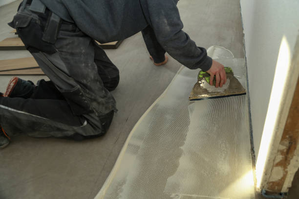 istock The worker installing new vinyl tile floor 1193308013