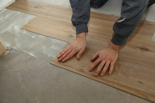 istock The worker installing new vinyl tile floor 1193308050