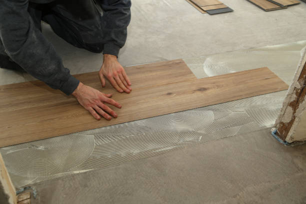 istock The worker installing new vinyl tile floor 1193308080