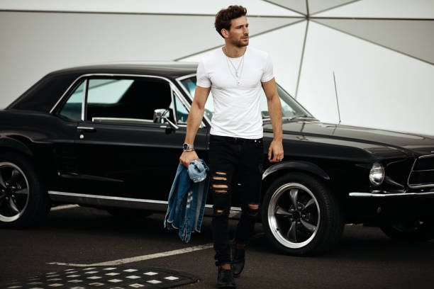 istock Handsome man with old classic car 1193308817