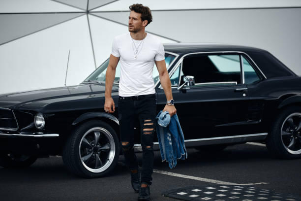 istock Handsome man with old classic car 1193309482