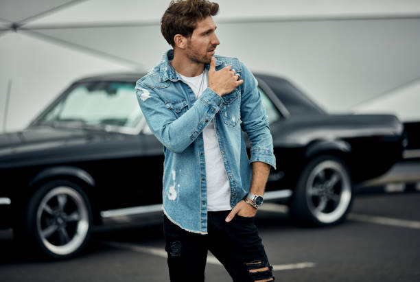 istock Handsome man with old classic car 1193310674