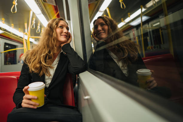 istock Businesswoman daydreaming in train 1193315611