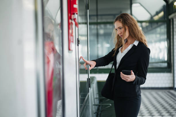 istock Businesswoman checking the timetable 1193316183