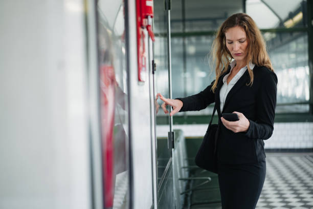 istock Businesswoman checking the timetable 1193316278