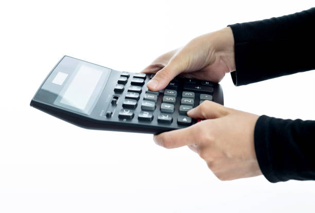 Woman hand holding calculator on white background.