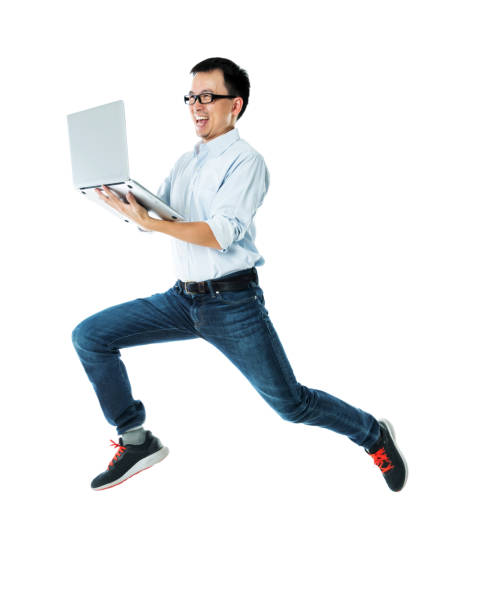 istock Businessman jumping with laptop on white background 1193317700