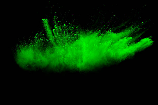 istock Green color powder explosion cloud on black background.Green dust splash. 1193320008