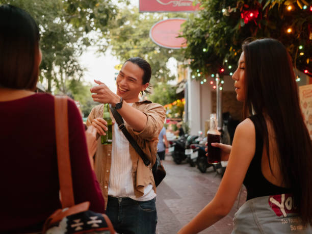 istock Young friends embracing and having fun together and drinking alcohol 1193329375