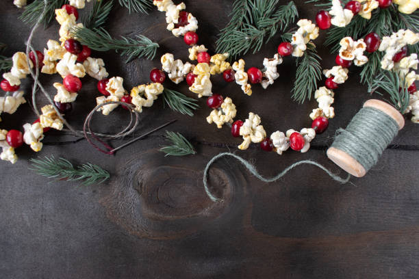 Christmas garland of red cranberries and popcorn kernels stock photo
