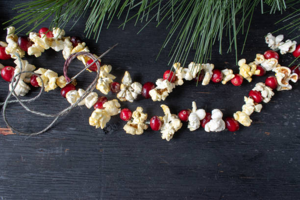 Christmas garland of red cranberries and popcorn kernels stock photo