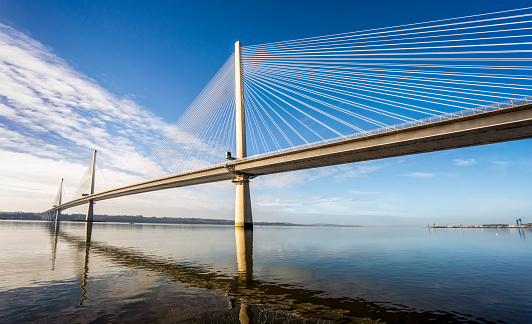 A panoramic image of the Queensferry Crossing, the third bridge over the Firth of Forth in Scotland, connecting Fife with the Lothians and Edinburgh.