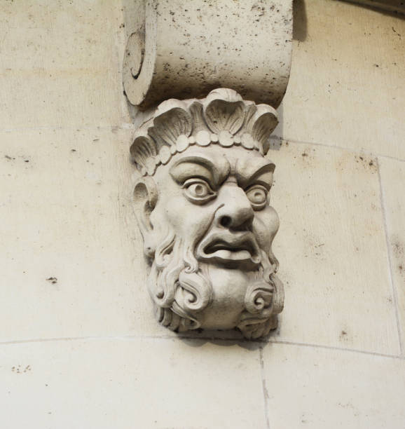 istock Sculpted stone mask on Pont Neuf in Paris 1193336321