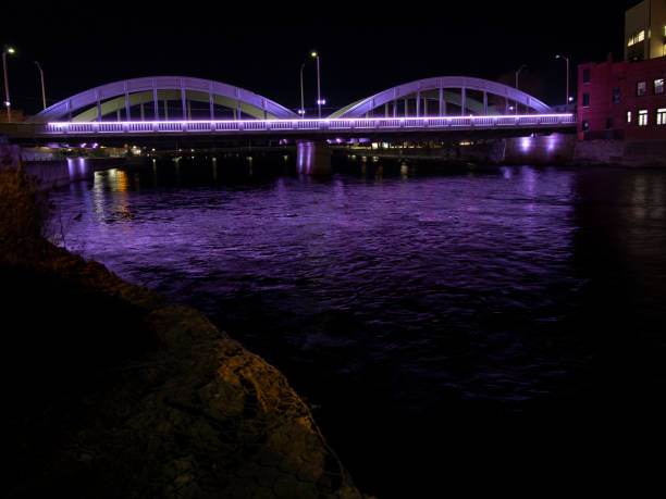 Illuminated bridge at night stock photo