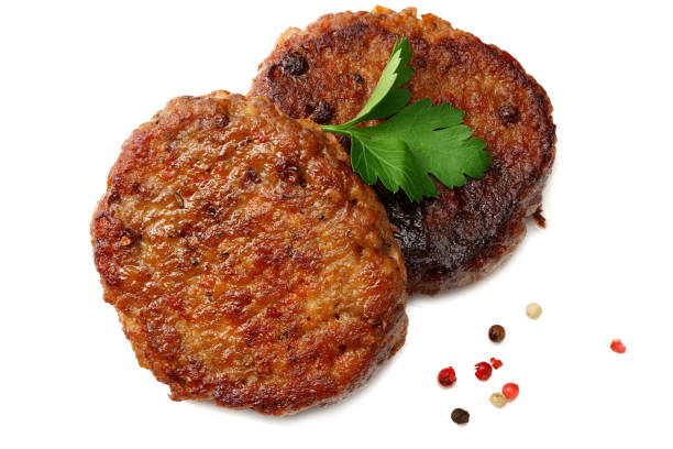 istock grilled burger meat with spices isolated on white background. top view 1193340018