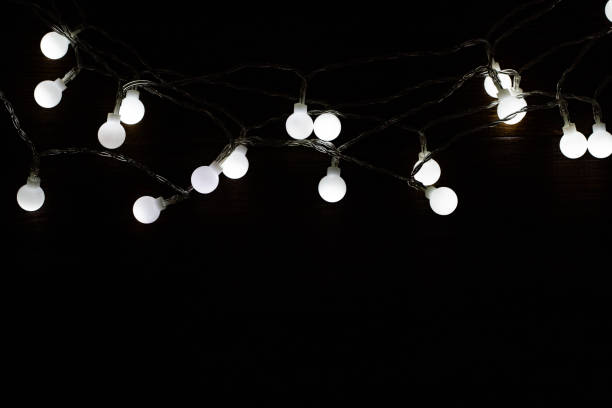 istock Christmas lights over wooden background, copy space 1193348024