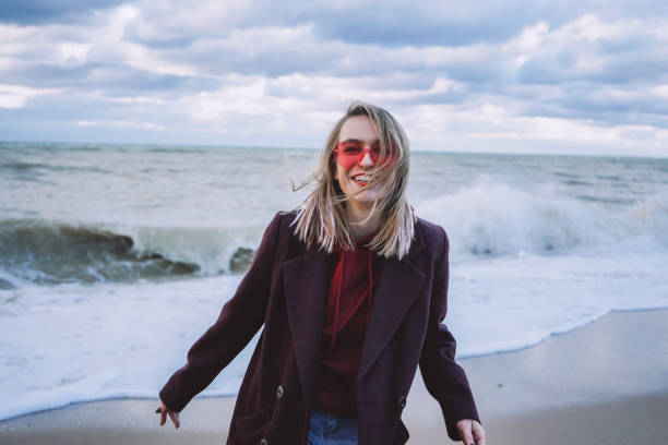 istock Girl on the winter seashore 1193348880