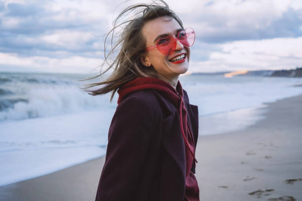 istock Girl on the winter seashore 1193348897
