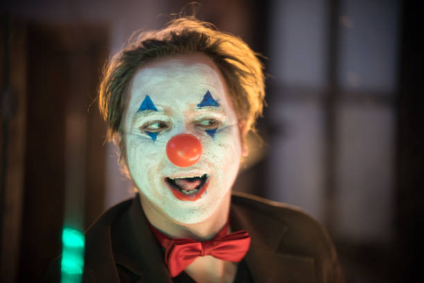 istock Clown concept - a man with painted silly face 1193349166